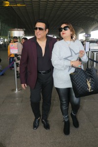 Hero No 1 Govinda and his wife Sunita Ahuja spotted at mumbai airport on Dec 25