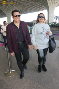 Hero No 1 Govinda and his wife Sunita Ahuja spotted at mumbai airport on Dec 25