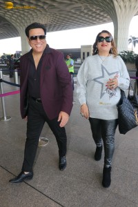 Hero No 1 Govinda and his wife Sunita Ahuja spotted at mumbai airport on Dec 25