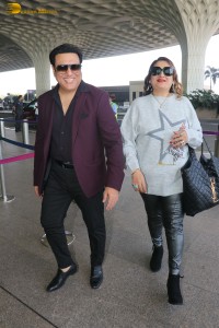 Hero No 1 Govinda and his wife Sunita Ahuja spotted at mumbai airport on Dec 25