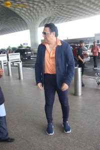 Bollywood Superstar Govinda stops and waits for a fan in wheelchair to take pictures