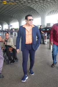 Bollywood Superstar Govinda stops and waits for a fan in wheelchair to take pictures