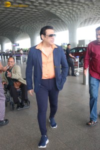 Bollywood Superstar Govinda stops and waits for a fan in wheelchair to take pictures