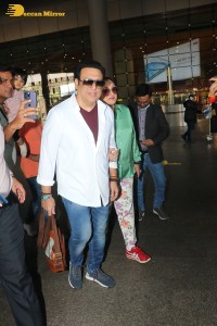 Bollywood actor govinda and his wife sunita ahuja at airport