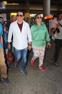 Bollywood actor govinda and his wife sunita ahuja at airport