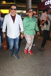 Bollywood actor govinda and his wife sunita ahuja at airport