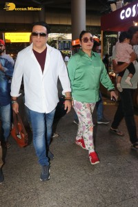 Bollywood actor govinda and his wife sunita ahuja at airport