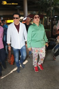 Bollywood actor govinda and his wife sunita ahuja at airport