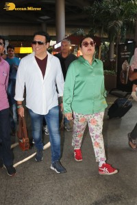 Bollywood actor govinda and his wife sunita ahuja at airport
