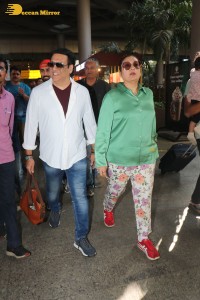 Bollywood actor govinda and his wife sunita ahuja at airport