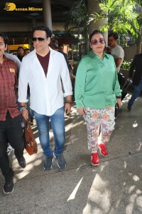 Bollywood actor govinda and his wife sunita ahuja at airport