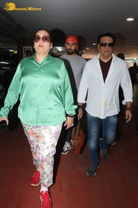 Bollywood actor govinda and his wife sunita ahuja at airport
