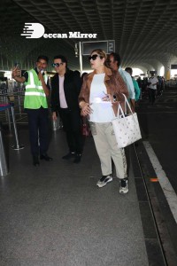 Bollywood Superstar Govinda Surprised by Photographers with a Birthday Cake at Airport on December 20
