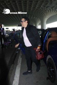 Bollywood Superstar Govinda Surprised by Photographers with a Birthday Cake at Airport on December 20