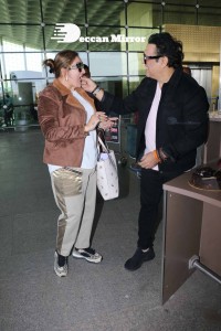 Bollywood Superstar Govinda Surprised by Photographers with a Birthday Cake at Airport on December 20