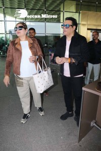 Bollywood Superstar Govinda Surprised by Photographers with a Birthday Cake at Airport on December 20