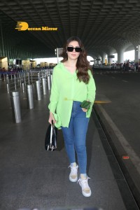 Hansika Motwani in a green shirt and blue denim jeans