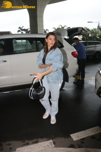 Actress Hansika Motwani in denim jeans and denim jacket at the airport