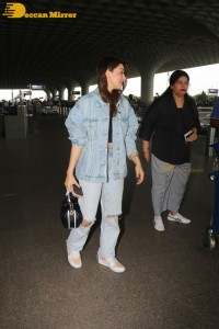Actress Hansika Motwani in denim jeans and denim jacket at the airport