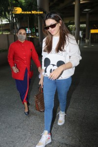 Hansika Motwani seen at Mumbai Airport in white t-shirt and blue jeans