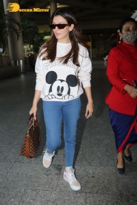 Hansika Motwani seen at Mumbai Airport in white t-shirt and blue jeans