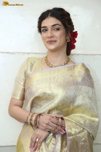 actress Hassini Sudhir in a gold color saree