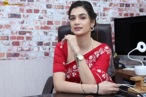 actress Hassini Sudhir glamorous look in a red saree