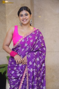 actress Hebah Patel stylish in a pink blouse and purple saree
