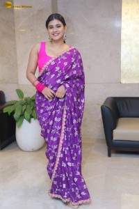 actress Hebah Patel stylish in a pink blouse and purple saree