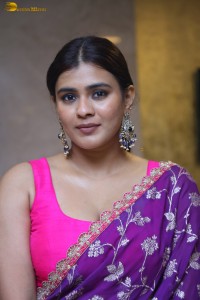actress Hebah Patel stylish in a pink blouse and purple saree