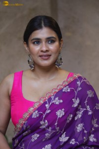 actress Hebah Patel stylish in a pink blouse and purple saree