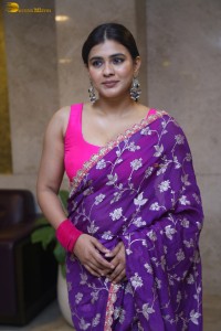 actress Hebah Patel stylish in a pink blouse and purple saree