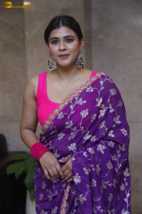 actress Hebah Patel stylish in a pink blouse and purple saree