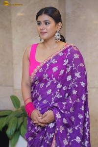 actress Hebah Patel stylish in a pink blouse and purple saree