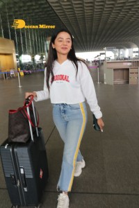 Helly Shah spotted at Mumbai Airport in white t-shirt and blue jeans