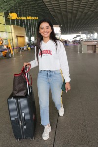 Helly Shah spotted at Mumbai Airport in white t-shirt and blue jeans