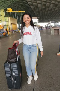 Helly Shah spotted at Mumbai Airport in white t-shirt and blue jeans