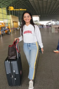 Helly Shah spotted at Mumbai Airport in white t-shirt and blue jeans