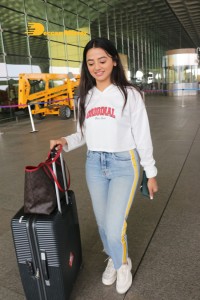 Helly Shah spotted at Mumbai Airport in white t-shirt and blue jeans