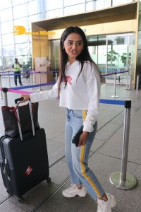 Helly Shah spotted at Mumbai Airport in white t-shirt and blue jeans