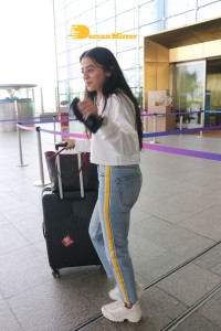 Helly Shah spotted at Mumbai Airport in white t-shirt and blue jeans