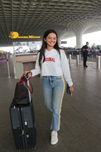 Helly Shah spotted at Mumbai Airport in white t-shirt and blue jeans