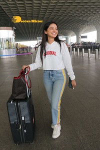 Helly Shah spotted at Mumbai Airport in white t-shirt and blue jeans