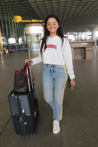 Helly Shah spotted at Mumbai Airport in white t-shirt and blue jeans