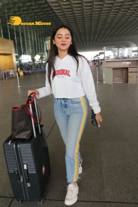 Helly Shah spotted at Mumbai Airport in white t-shirt and blue jeans