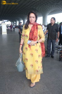 bollywood actress and politician hema malini spotted at mumbai airport
