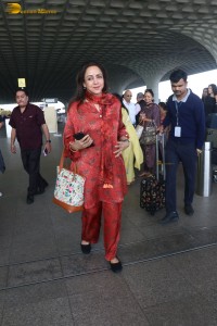 bollywood actress hema malini spotted in a red dress at mumbai airport