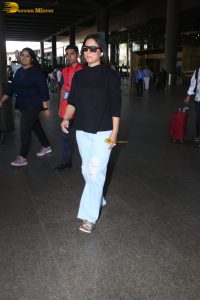 Indian actress hina khan in black t-shirt and denim jeans at airport