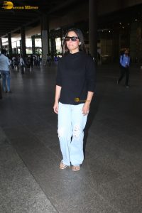 Indian actress hina khan in black t-shirt and denim jeans at airport