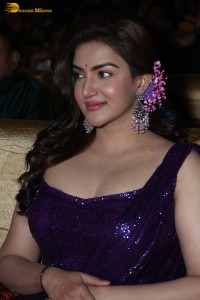 actress honey rose glamorous look in a purple dress at a function